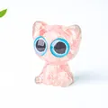 Pink translucent resin cat figurine with natural crystal fragments and large blue eyes - Watermelon Quartz