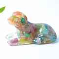 Puppy figurine made of resin with colorful natural crystal stones on white backdrop - Colorful Cat Eye
