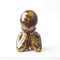 Artistic resin statue with natural tiger eye crystals in a contemplative pose - Tiger's Eye