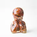 Human bust statue crafted with red crystal stones and resin for home desk decoration - Red Agate