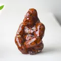 Gorilla statue made of reddish-brown natural crystal stones in transparent resin - Red Jasper