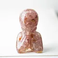 Minimalist resin statue with pink crystal shards in a seated human portrait silhouette - Strawberry Quartz