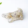 Golden rutilated quartz crocodile figurine with natural crystal needles on white surface - Rutilated Quartz (Cute Shape)
