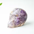 Skull decor made of translucent resin filled with natural purple amethyst crystal stones - Dreamy Purple