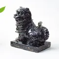 Black obsidian resin tiger statue with crystalline eyes and a glossy mirror finish - Obsidian