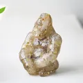 Artistic resin gorilla statue with amber crystals and gold foil for desk decor - Rutilated Quartz