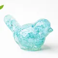 Light blue resin bird figurine with sparkling natural crystal stone fillings - Aquamarine