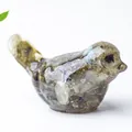 Resin bird statue with natural crystal stones inside and vibrant colorful textures - Black Labradorite