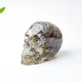 Skull decor made of resin with natural crystal stones for desk ornament - Labradorite