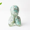 Abstract human-shaped resin statue filled with light blue natural crystal stones - Amazonite
