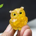 Translucent yellow resin owl figurine with crystal details in a compact handheld size - Citrine