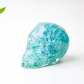 Blue natural crystal skull sculpture made of resin and crushed stone for desktop decor - Aquamarine