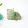 Detailed macro view of a green resin cat figurine with realistic fur textures and translucency - Green Aventurine