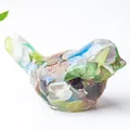 Bird statue crafted in clear resin with colorful natural crystal stone chips - Colorful Cat Eye