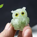 Green crystal resin owl figurine with yellow eyes held in hand for size display - Green Aventurine