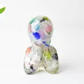 Artistic human bust sculpture filled with colorful sea glass fragments and stones - Colorful Cat Eye