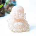 Miniature laughing Buddha statue crafted with pink crystal stones and resin finish - Rose Quartz