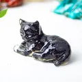 Figurine chat endormi en résine noire avec pierres de cristal naturel à l'intérieur - Obsidienne