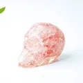 Pink resin skull figurine with natural crystal stone inlay for desktop decoration - Watermelon Quartz