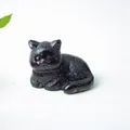 Polished black resin cat figurine with detailed texture for home office desk decor - Obsidian