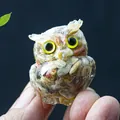 Miniature resin owl figurine with colorful natural stones and bright yellow eyes - Crazy Agate