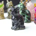 Polished black obsidian lucky cat figurine with various colorful crystal cat statues - Obsidian