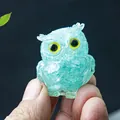 Miniature light blue resin owl figurine with yellow eyes and crystal stone inlay - Aquamarine