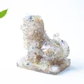 Resin crystal tiger statue with embedded gemstones on a square transparent base - Rutilated Quartz