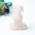 Pink quartz dog figurine in meditation pose with natural crystal texture and details - Rose Quartz