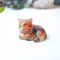 Miniature cat figurine made of clear resin with amber crystal stone chips and warm tones - Red Agate