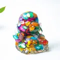 Laughing Buddha statue made of clear resin with colorful natural crystal stones - Colorful Shell