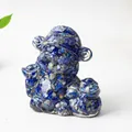 Deep blue natural crystal and resin fortune deity figure with gold ingot in hand - Lapis Lazuli