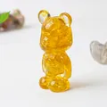 Amber crystal resin bear figurine with natural stone texture and cute bowtie detail - Citrine