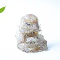 Laughing Buddha statue in clear resin with colorful natural crystal stone fill - Rutilated Quartz