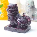 Resin tiger crystal statue in deep red translucent finish with integrated base - Garnet