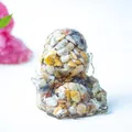 Laughing Buddha statue in clear resin with colorful natural crystal stones inside - Crazy Agate