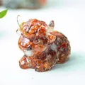 Resin highland cow figurine filled with natural orange crystals for desktop decor - Red Agate
