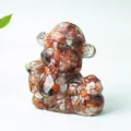 Creative resin monkey figurine filled with natural reddish-brown and grey crystal stones - Red Agate