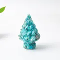 Artisan Christmas tree ornament crafted from turquoise resin with natural mineral texture - Turquoise