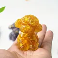 Amber resin teddy dog figurine with crushed crystal texture in palm-sized variant - Citrine