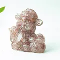 Translucent pink crystal Caishen figurine with natural mineral texture for home decor - Strawberry Quartz