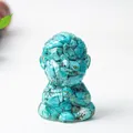 Meditating monk figurine crafted from green turquoise resin for Zen desktop decoration - Turquoise