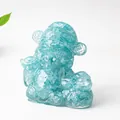 Light blue resin God of Wealth statue with natural crystals for home and shop decor - Aquamarine