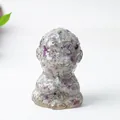 Meditating monk figurine with purple and green fluorite crystals in resin - Colorful Fluorite