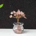 Handmade rose quartz crystal money tree ornament in a glass bowl on white table - Strawberry Quartz