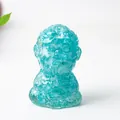 Meditating monk statue in light blue resin with natural crystal texture for desk decor - Aquamarine