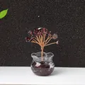 Handmade red garnet crystal tree with copper wire on a glass bottle base decor - Garnet