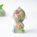 Colorful resin Monkey King crystal figurine in a peaceful meditative sitting pose - Colorful Cat Eye