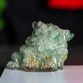 Translucent emerald green crystal three-legged toad figurine with gold inscription - Green Aventurine