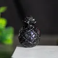 Modern black crystal resin pineapple ornament with textured diamond cut finish - Obsidian